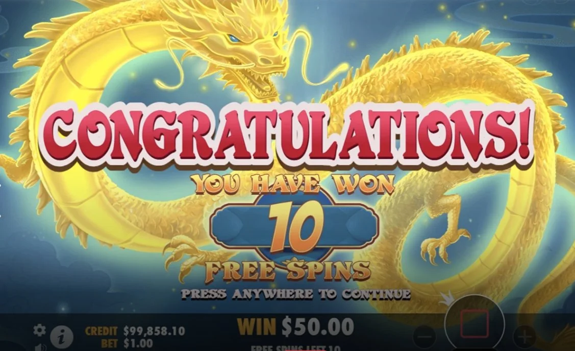 Golden dragon congratulations screen awarding 10 free spins in Mahjong Wins Super Scatter